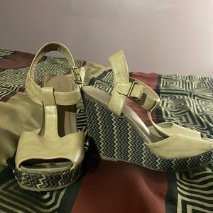 Pair of wedges, they were worn when I was younger. They are size 8 Faded Glory.